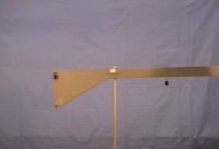 Irregularly shaped bar with hooks to hang masses.