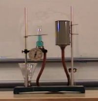 Pascal's vases: two cans partly  filled with water, bottoms connected by hose