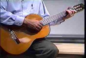 Strumming a guitar
