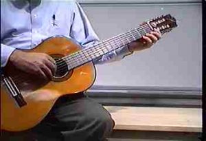 Plucking different  guitar strings