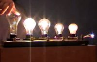 FIve light bulbs with as thin wire in series acting as a fuse.