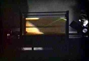 Light beam is reflected back into a water-filled acquarium