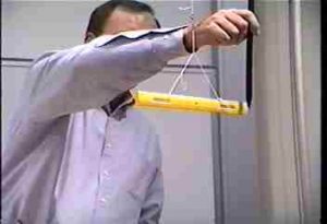 A charged balloon attracts a ruler