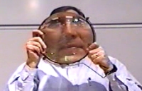 Large convex lens magnifies the instructor's face